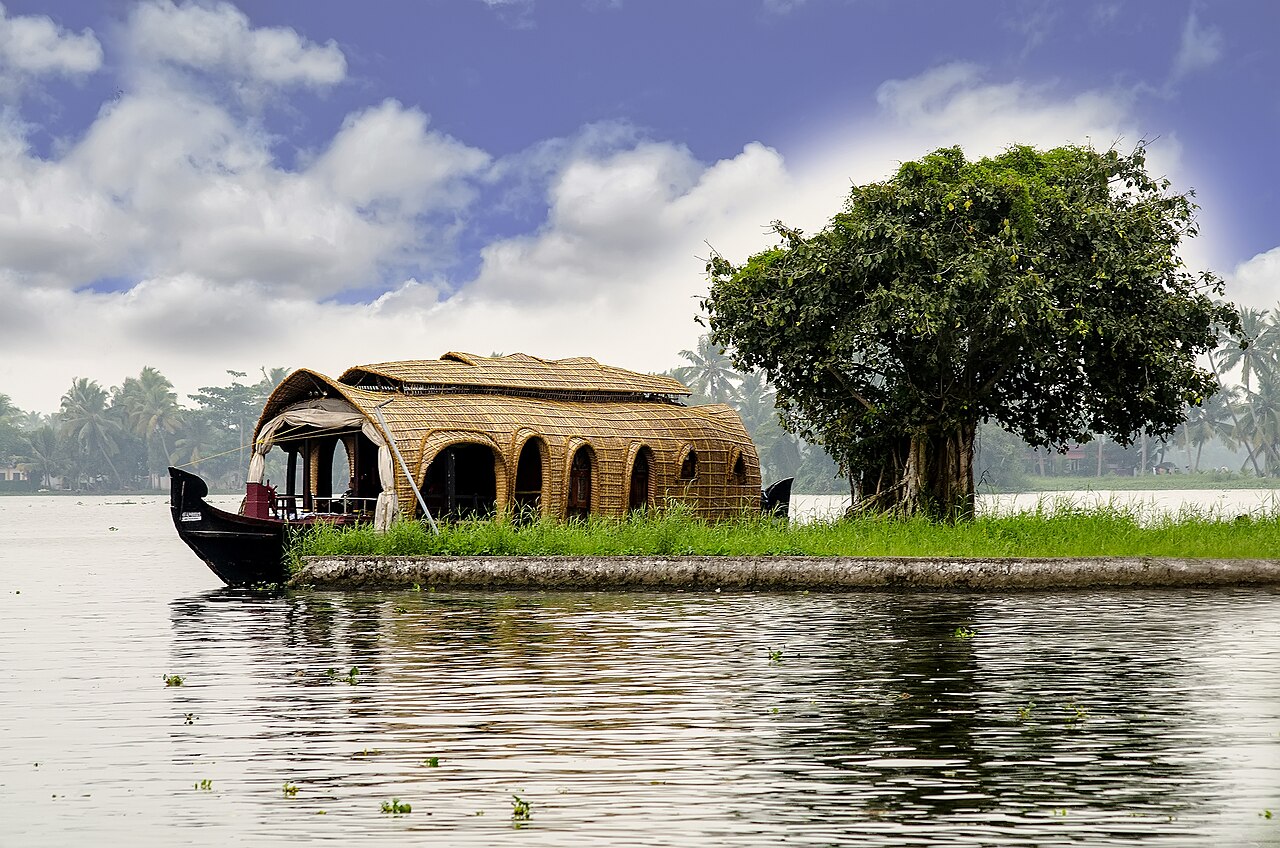 Traditional luxury houseboat cruising in Alleppey backwaters Kerala